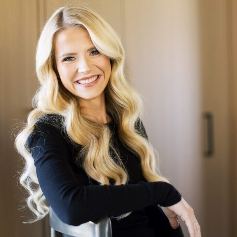 Elizabeth Smart sitting down on a chair